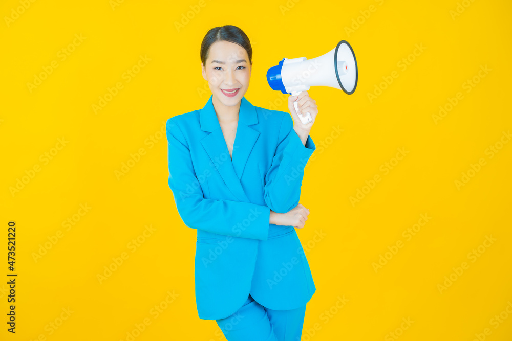 Fototapeta premium Portrait beautiful young asian woman smile with megaphone
