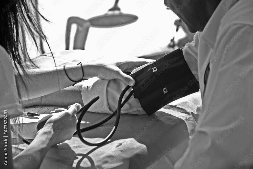 Woman taking blood pressure