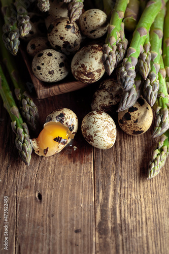 Raw asparagus and quail eggs.