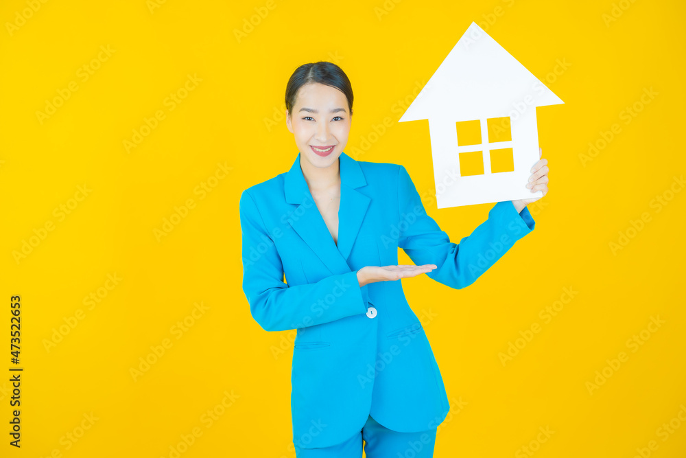 Portrait beautiful young asian woman with house or home paper sign Portrait beautiful young asian woman with house or home paper sign