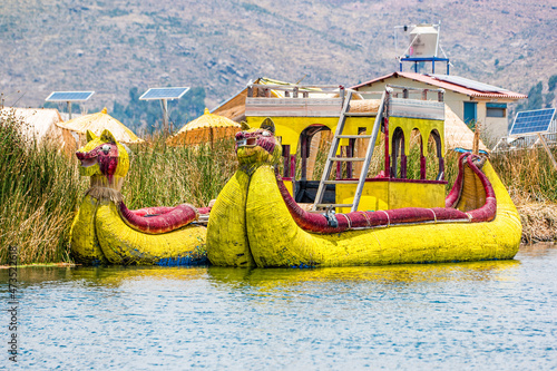 Traditional boat on the floating islands of Uros on Lake Titicaca in Peru photo