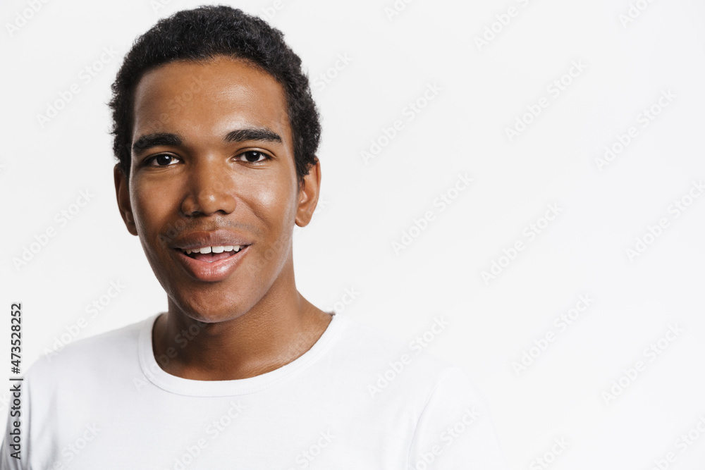 Young black man dressed t-shirt smiling and looking at camera Young black man dressed t-shirt smiling and looking at camera