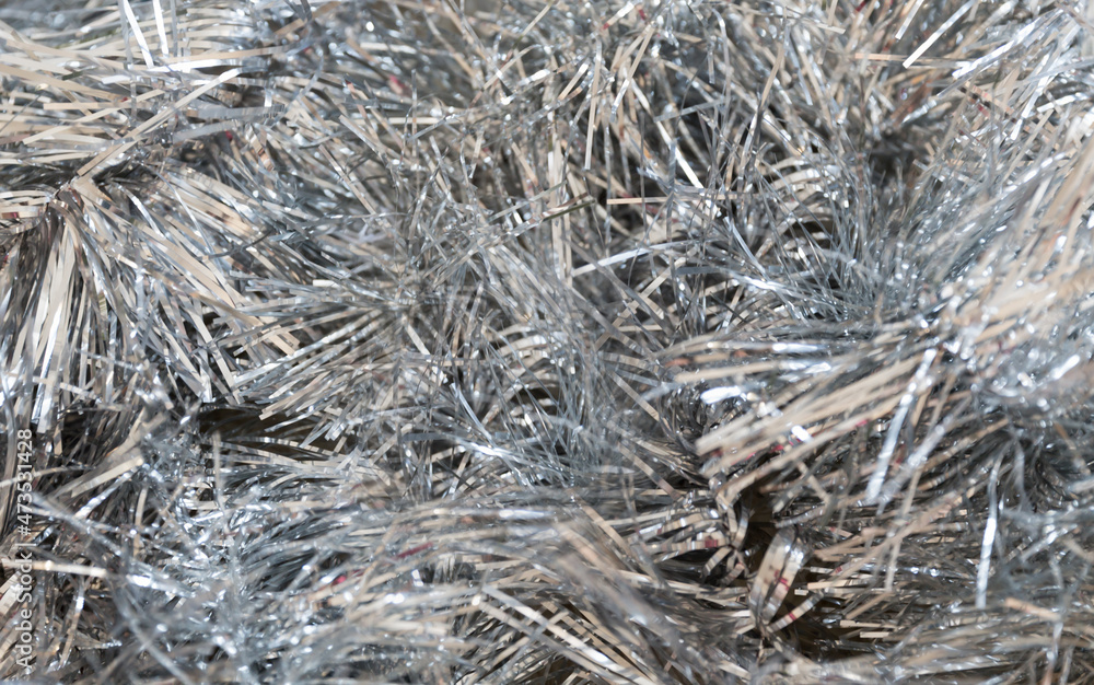 Silver Christmas background, tinsel full frame.