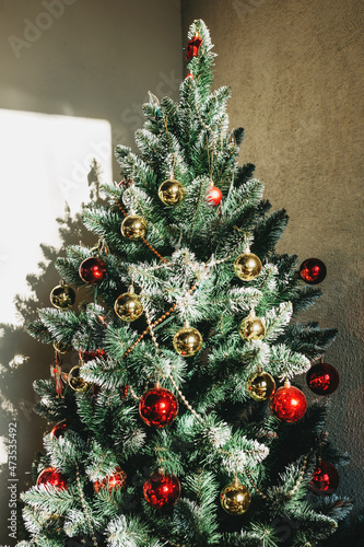 Christmas decorations on the Christmas tree. Celebrating Christmas, New Year and festive concept.