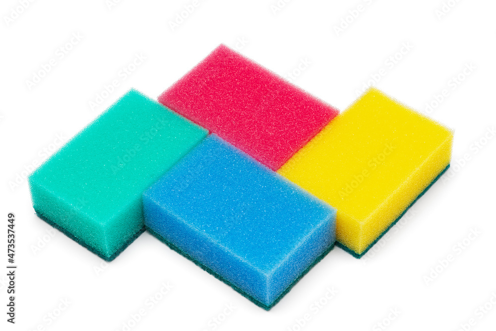 Group of rectangular foam sponges of blue, green, yellow and pink colors for everyday washing and cleaning of kitchen utensils on white background. Close-up view, horizontal composition. Group of rectangular foam sponges of blue, green, yellow and pink colors for everyday washing and cleaning of kitchen utensils on white background. Close-up view, horizontal composition.