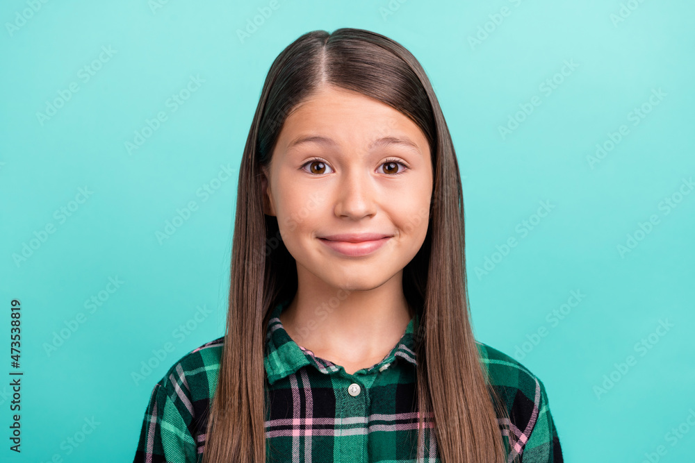 Fototapeta premium Photo of pretty cute school girl dressed checkered clothes smiling isolated teal color background