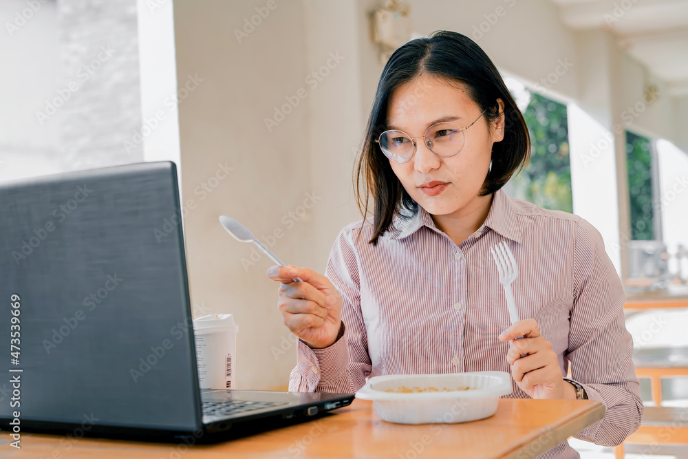 Woman working online through mobile phone and notebook computer. Woman working online through mobile phone and notebook computer.