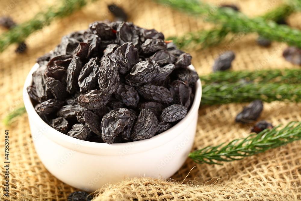 Fresh harvested and sun dried black raisins. Fresh harvested and sun dried black raisins.