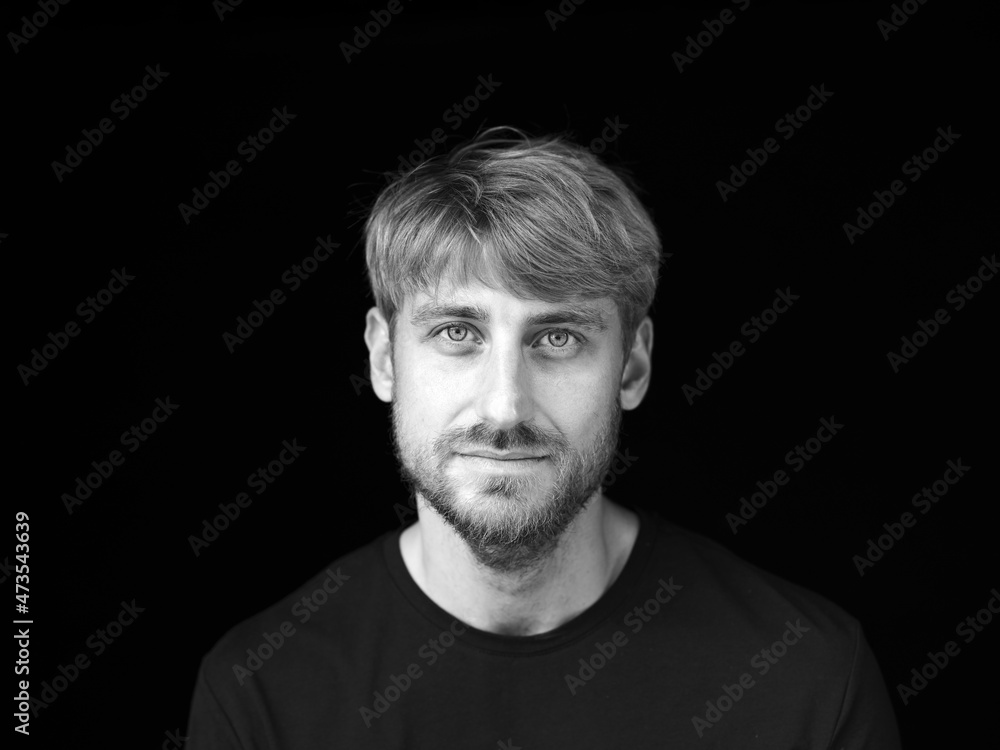 Handsome mid adult man against black background Handsome mid adult man against black background