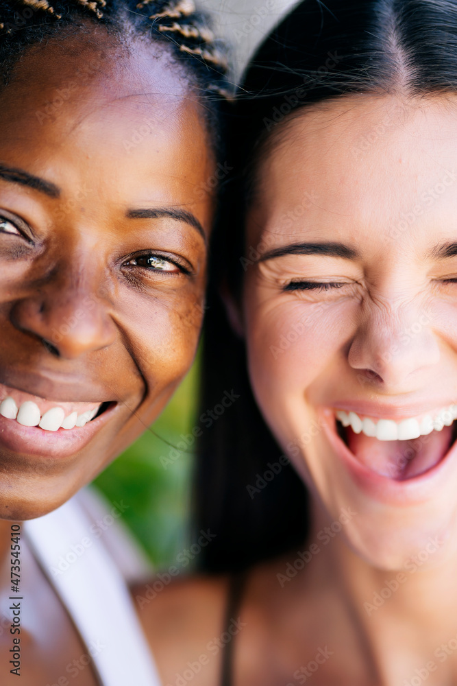 Laughing young woman with female friend Laughing young woman with female friend