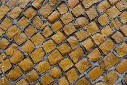 Background - texture of bright orange mosaic wall photo