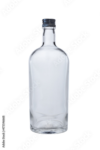 Closed with a metal stopper, an empty glass bottle for whiskey, cognac, brandy or rum. Isolated on a white background, close-up