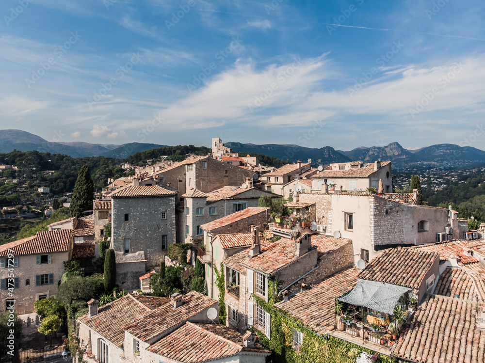 Drone shot from Saint-Paul-de-Vence. Medieval fortified village in the south of France. The narrow picturesque streets of the village. Stone facades of the 16th-18th centuries. Green Hills. Chapel