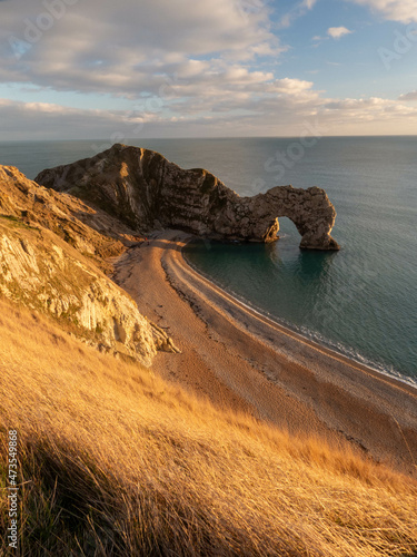 Durdle Door Jurassic coastline Dorset England as the sun starts to go down on a winters day