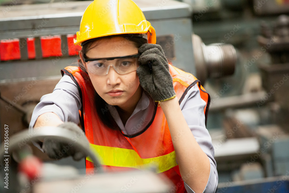 Industrial Engineers in Hard Hats.Work at the Heavy Industry Manufacturing Factory.industrial worker indoors in factory.aged man working in an industrial Industrial Engineers in Hard Hats.Work at the Heavy Industry Manufacturing Factory.industrial worker indoors in factory.aged man working in an industrial