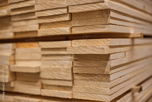 Fotografie Lumber from boards in warehouse or in store for construction.