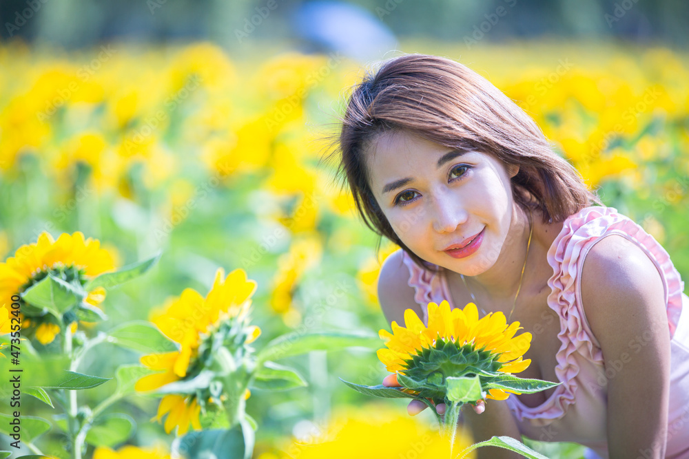 Asian woman at sunflower field portrait outdoor. Asian woman at sunflower field portrait outdoor.
