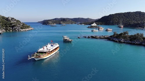 Drone shooting of the picturesque nature of the Turkish islands and the bay with turquoise sea water with sailing yachts on a rest photo