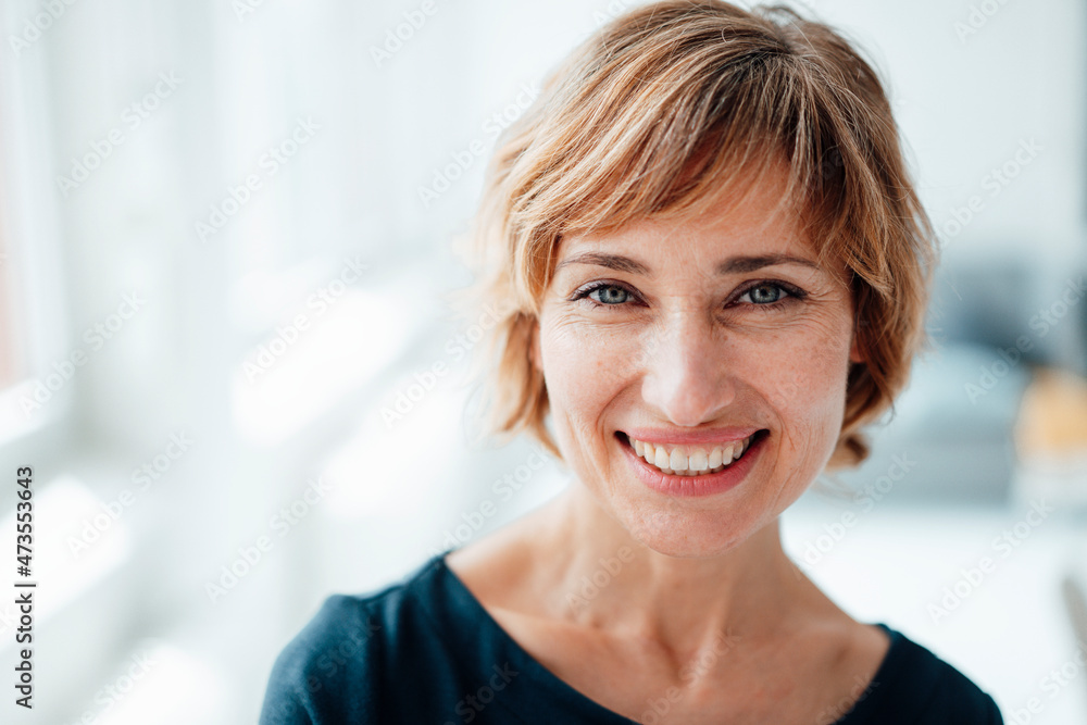 Smiling businesswoman in office Smiling businesswoman in office