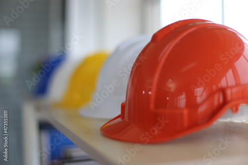 Selected focus on hardhats on table