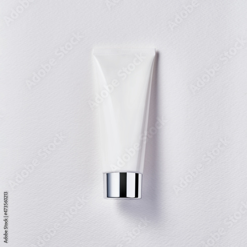 Cosmetics beauty product white tube with chrome cap on white background