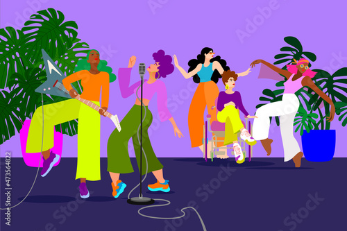group of women making music, playing the guitar and singing into a microphone while others dancing in the background and enjoying themselves