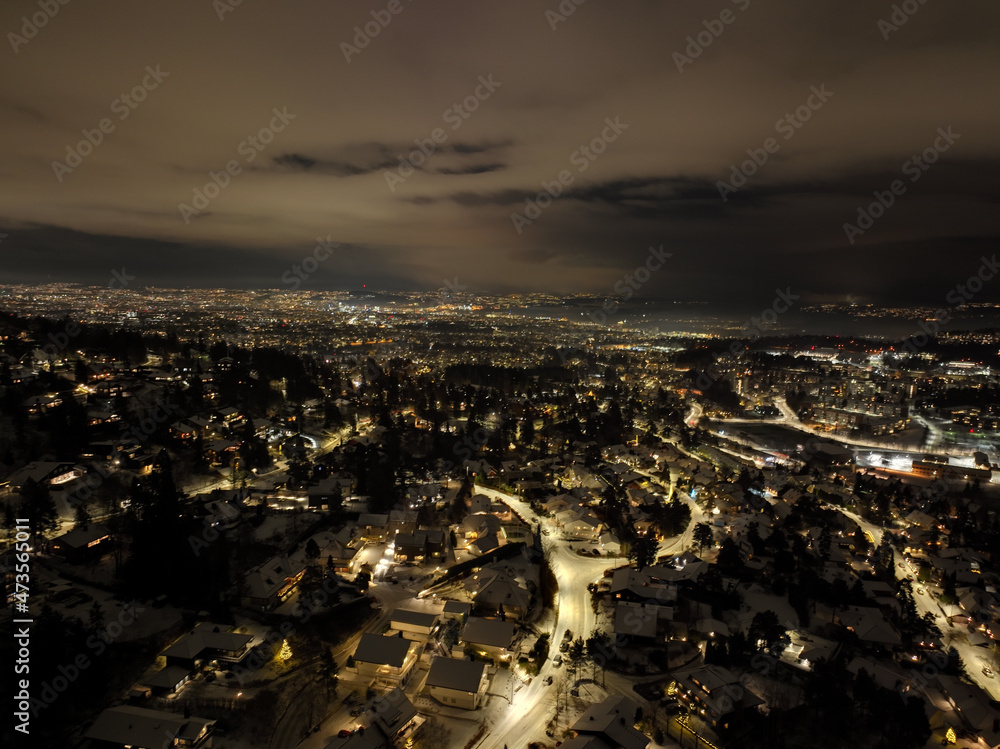 night city photo of oslo, norway a winter night. shot with a drone high up in the sky