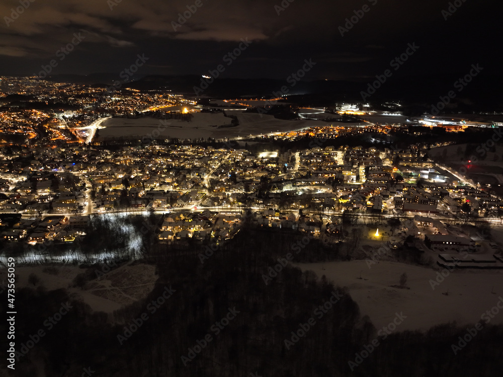 night city photo of oslo, norway a winter night. shot with a drone high up in the sky