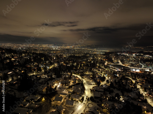 night city photo of oslo, norway a winter night. shot with a drone high up in the sky