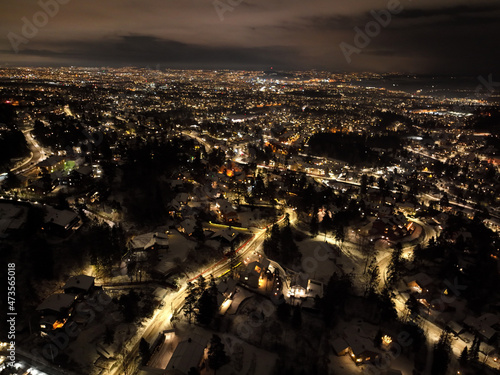 night city photo of oslo, norway a winter night. shot with a drone high up in the sky