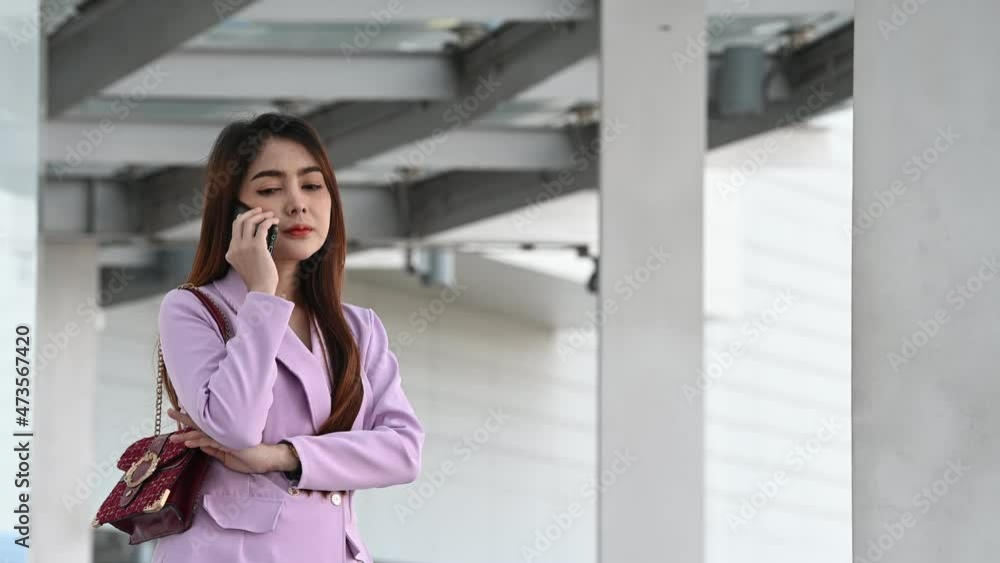 Business woman talk telephone with customers in the large city,Female asian at the departmentstore Business woman talk telephone with customers in the large city,Female asian at the departmentstore