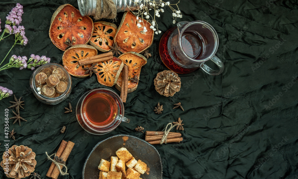 Hot bael fruit tea with bark of bael fruit and Crispy butter toast. The properties of hot bael fruit juice is a kind of herb - The concept of health. Drinks & Beverages, No focus, specifically. Hot bael fruit tea with bark of bael fruit and Crispy butter toast. The properties of hot bael fruit juice is a kind of herb - The concept of health. Drinks & Beverages, No focus, specifically.