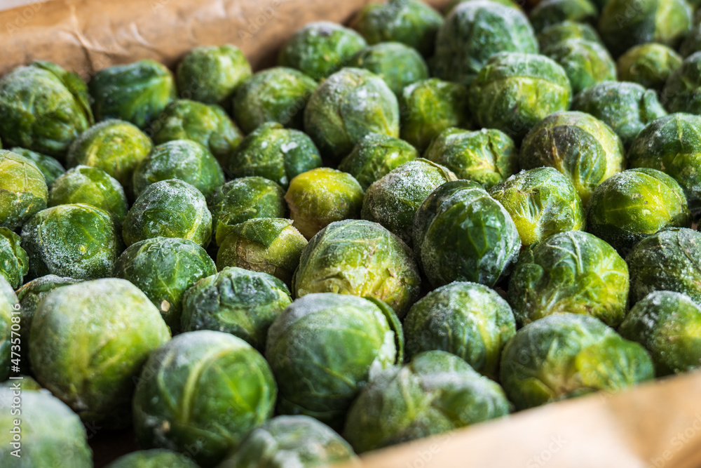 frozen frosty look brussels sprouts on baking tray closeup frozen frosty look brussels sprouts on baking tray closeup
