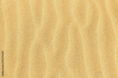 Sandy surface with dunes dunes on the beach uniform background.