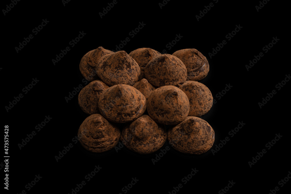 Chocolate truffles on a black background. Chocolate truffles on a black background.