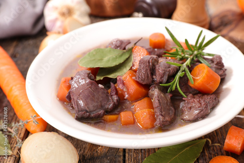 beef,  carrot cooked with sauce and herbs