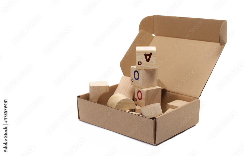 Open cardboard box with wooden cubes isolated on white background  
