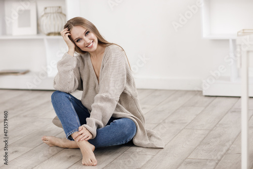 portrait of a smiling cozy woman indoor