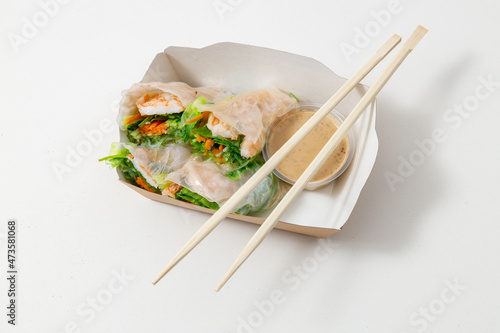 Raw fish and rice in sushi on white background