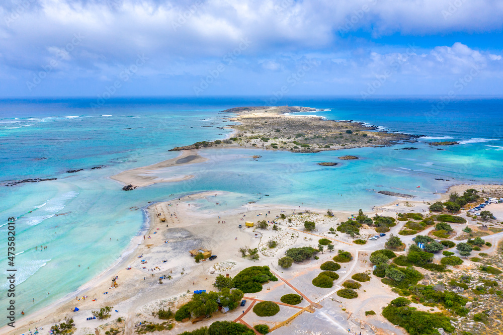 Tropical sandy beach with sandcastles and turquoise water, in Elafonisi, Crete, Greece Tropical sandy beach with sandcastles and turquoise water, in Elafonisi, Crete, Greece