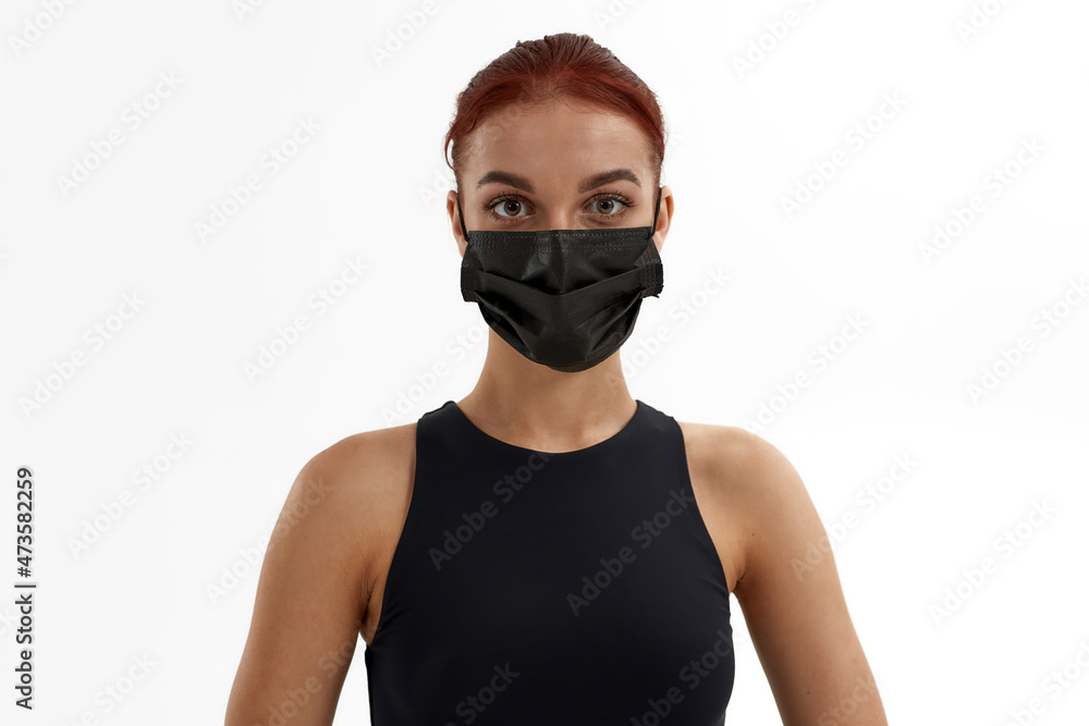 Caucasian female ballet dancer in medical mask Caucasian female ballet dancer in medical mask