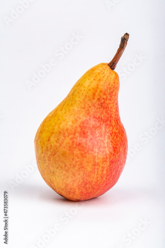 Red and yellow pear on a white background