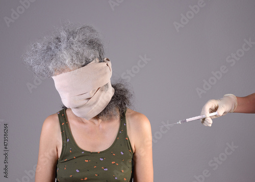 Person being forcefully vaccinated photo