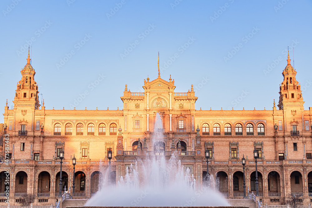 The Spain Square, in the Maria Luisa Park at sunset, in Seville, Spain. It is a landmark example of mixing elements of the Baroque, Renaissance and Moorish styles of Spanish architecture