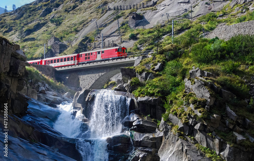 Train of the MGB, Matterhorn Gotthard Bahn, over the Teufelsbrücke between Andermatt and Göschenen in the Swiss canton of Uri.