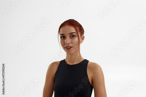 Serious female ballet dancer looking at camera