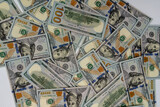 Background with banknotes of american 100 dollars bills. Cash money banknotes.