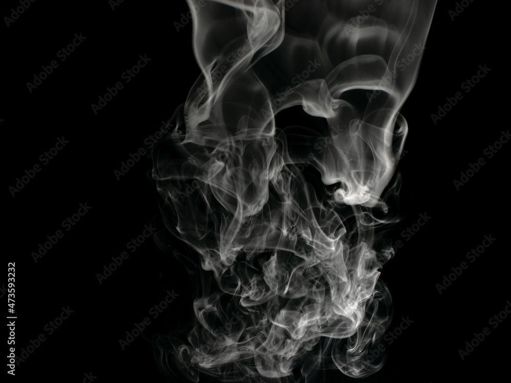 Chaotic mixing smoke creates abstract patterns on a black background Chaotic mixing smoke creates abstract patterns on a black background
