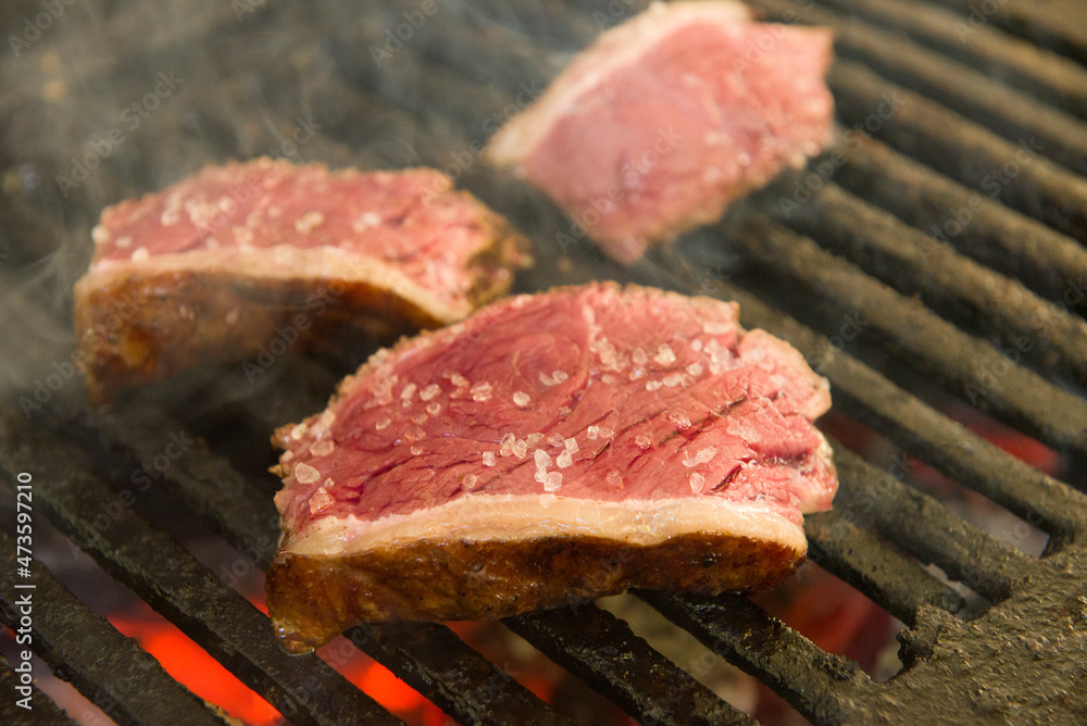 Barbecue sliced steak roasting on the coals. This form of barbecue is widely consumed throughout Brazil.