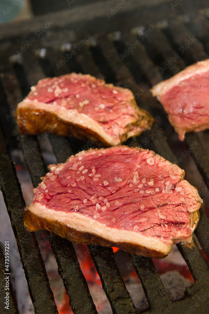 Barbecue sliced steak roasting on the coals. This form of barbecue is widely consumed throughout Brazil.